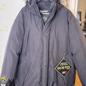 Supreme Black Puffer Jacket with Hood and Zipper Closure